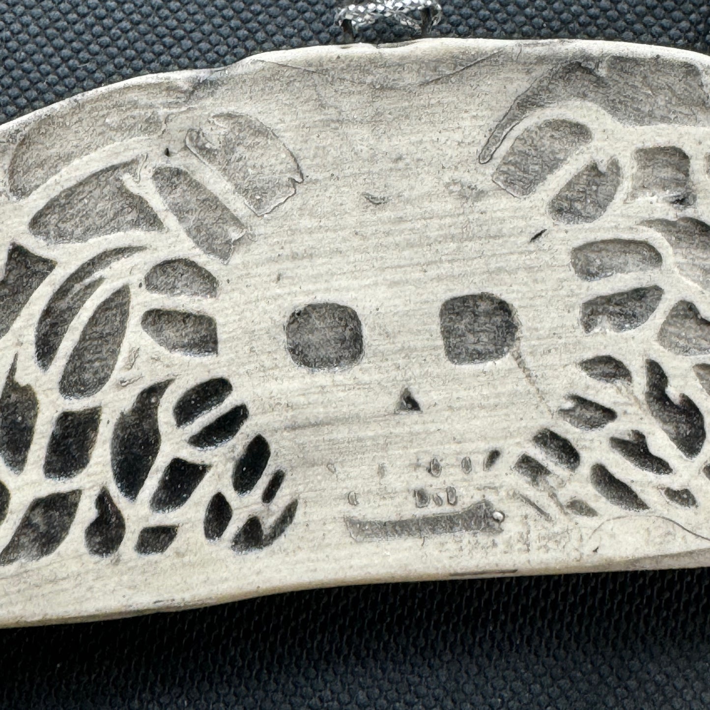 Handmade ceramic winged death's head ornament