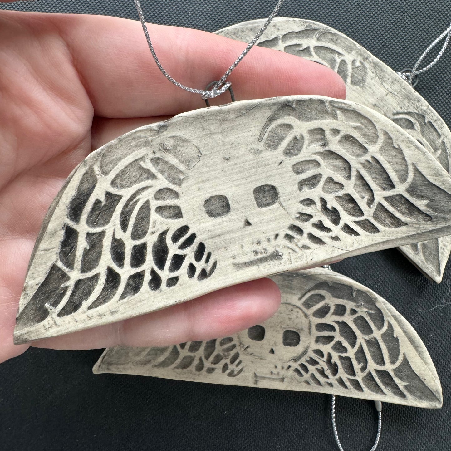 Handmade ceramic winged death's head ornament