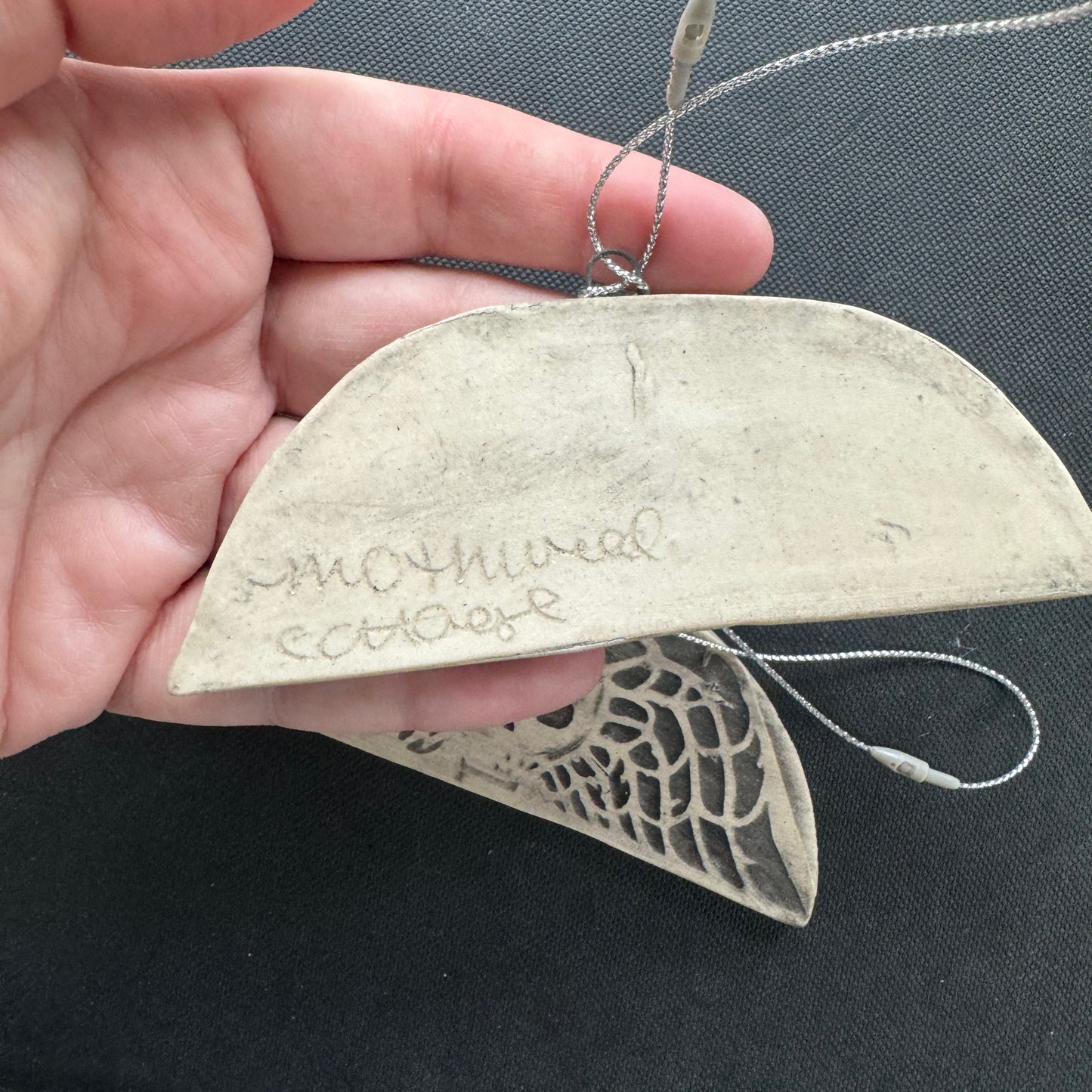 Handmade ceramic winged death's head ornament