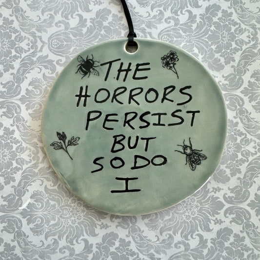 Handmade ceramic The Horrors Persist But So Do I wall hanging in blue grey