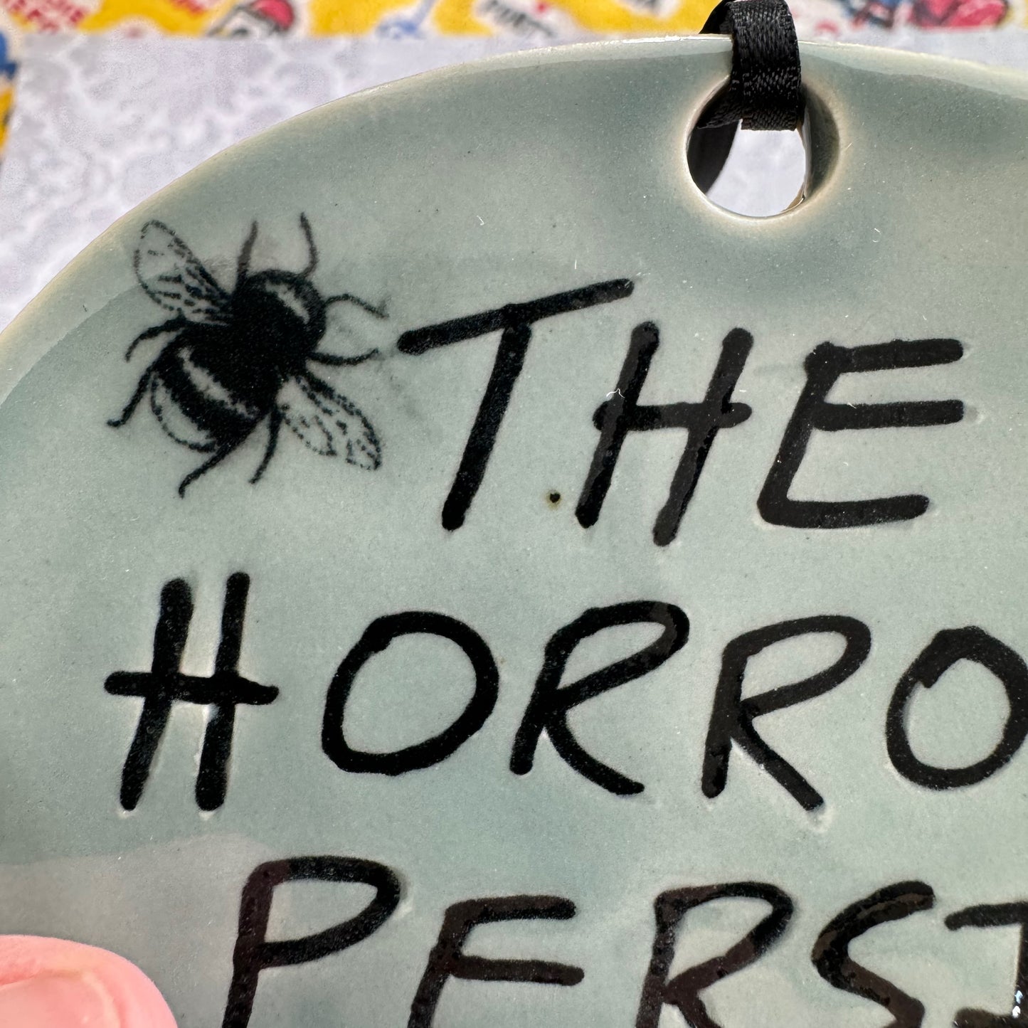 Handmade ceramic The Horrors Persist But So Do I wall hanging in blue grey