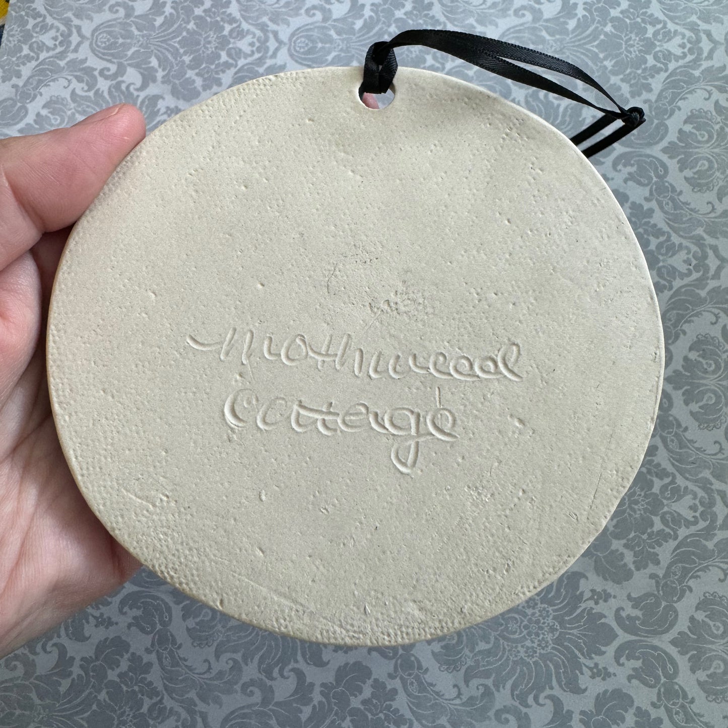 Handmade ceramic The Horrors Persist But So Do I wall hanging in blue grey