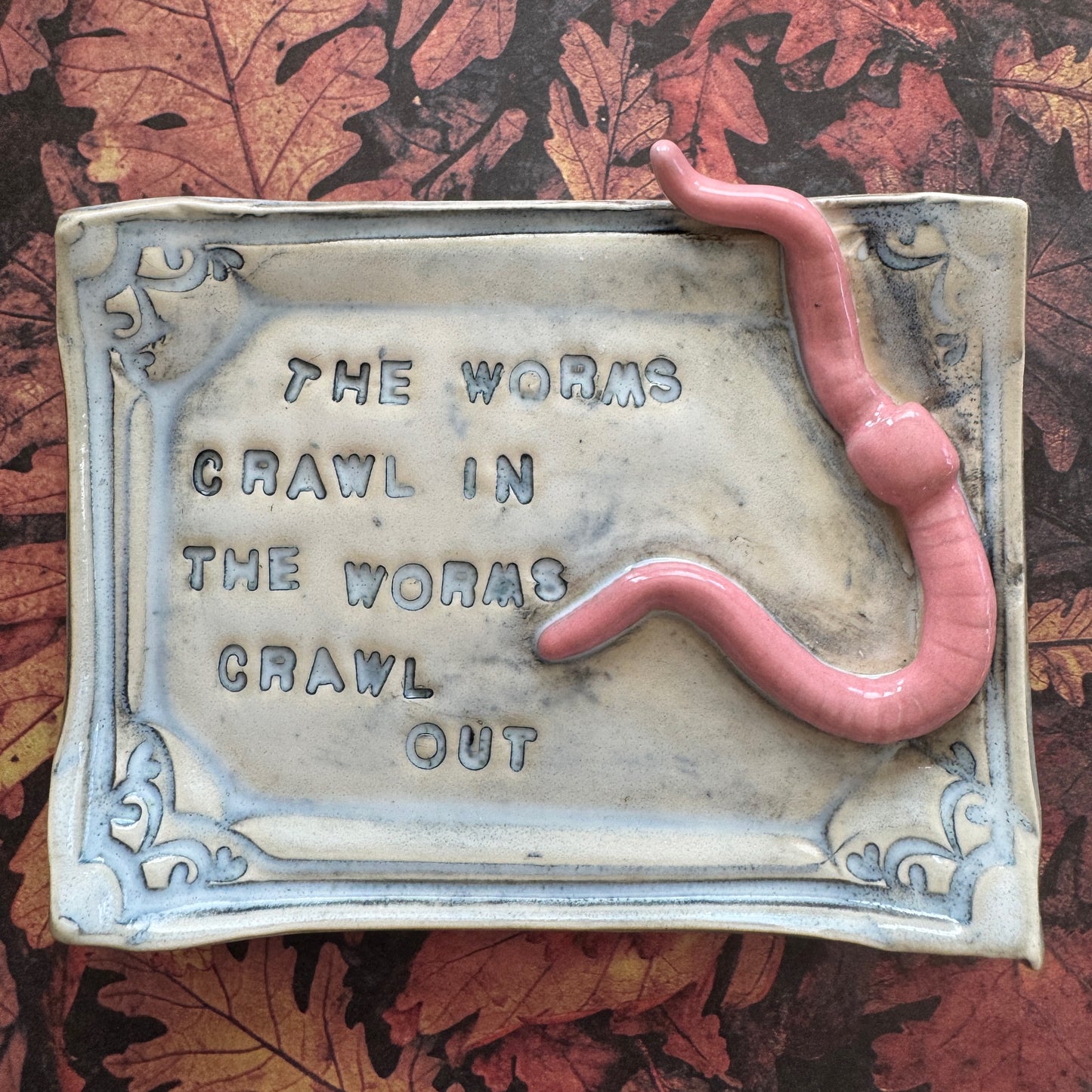 Handmade ceramic Worms Crawl In Worms Crawl Out curio trinket tray