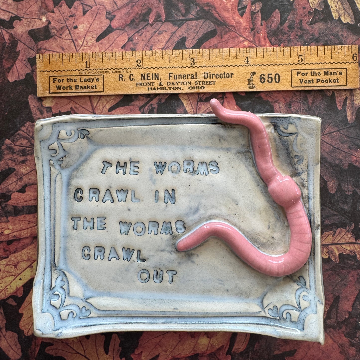 Handmade ceramic Worms Crawl In Worms Crawl Out curio trinket tray