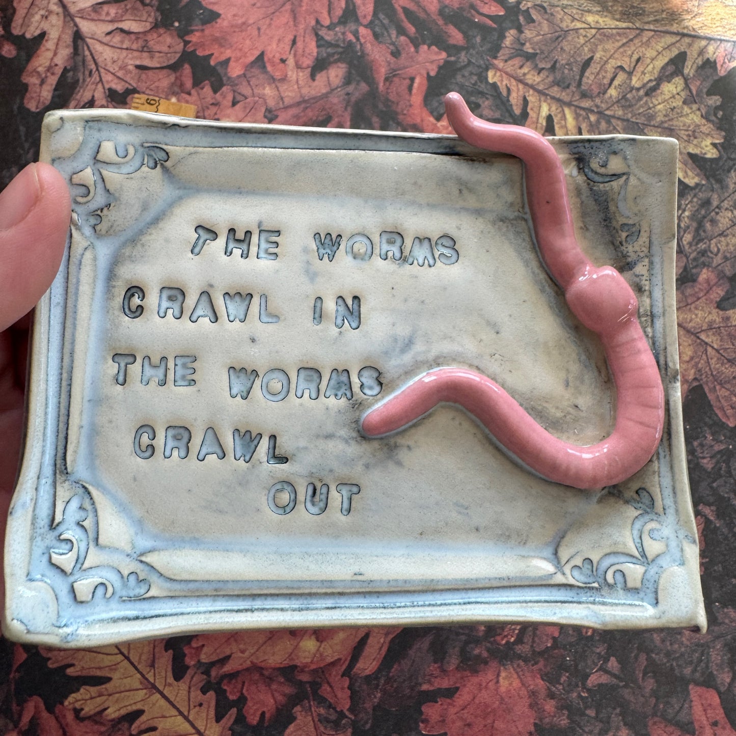 Handmade ceramic Worms Crawl In Worms Crawl Out curio trinket tray