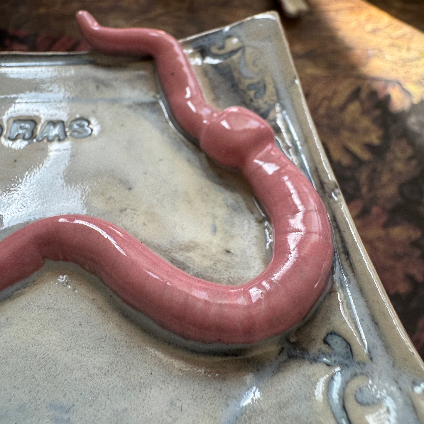 Handmade ceramic Worms Crawl In Worms Crawl Out curio trinket tray