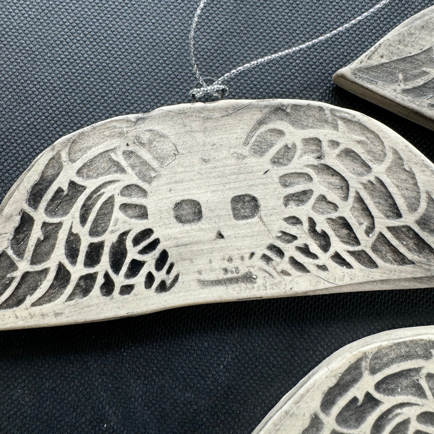Handmade ceramic winged death's head ornament