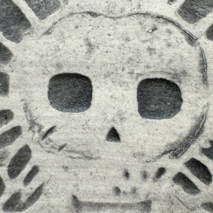 Handmade ceramic winged death's head ornament