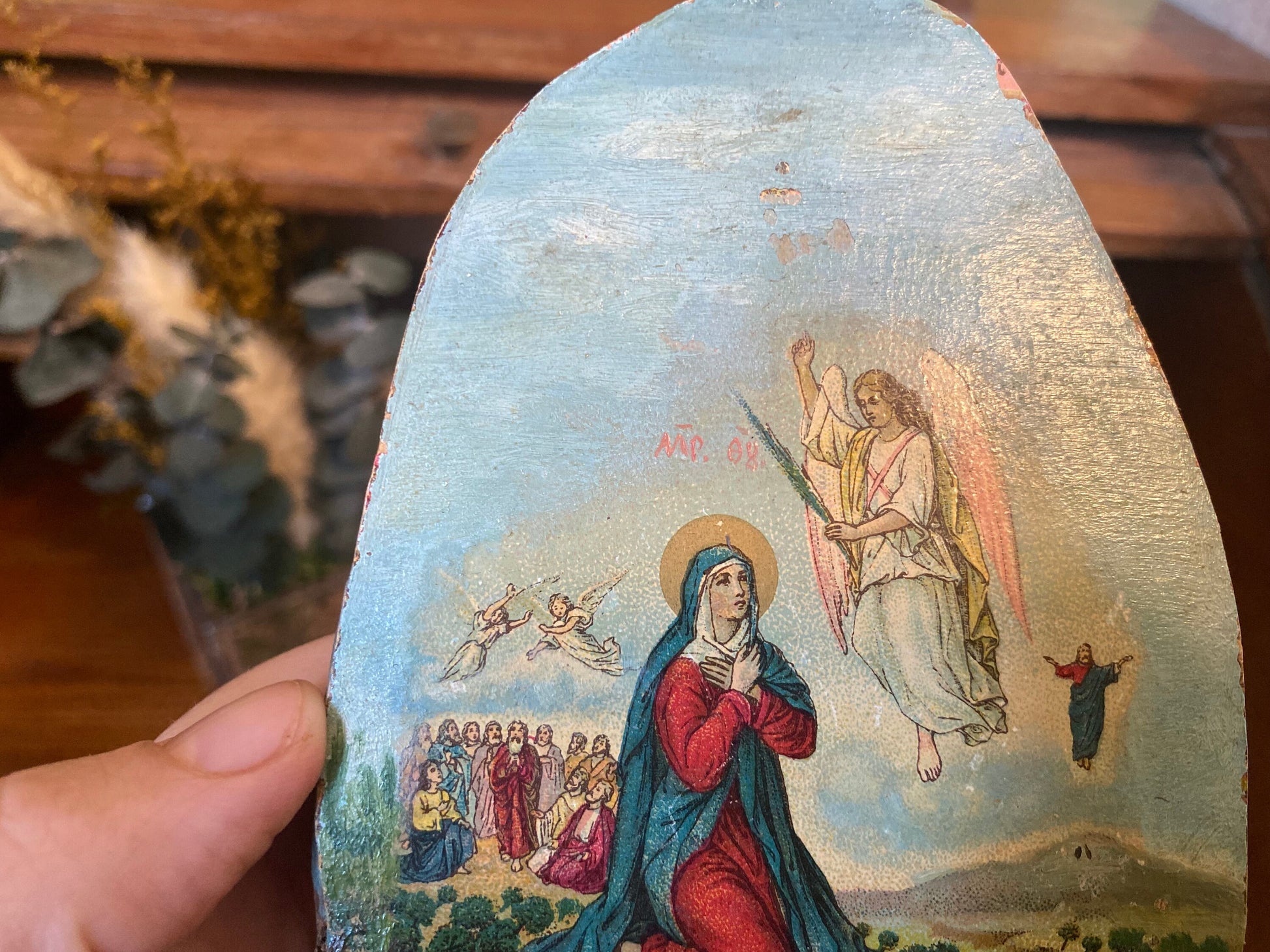 Vintage religious wood slice art with depiction of the Virgin Mary and the Ascension of Jesus on real rustic wood. Catholic home decor.